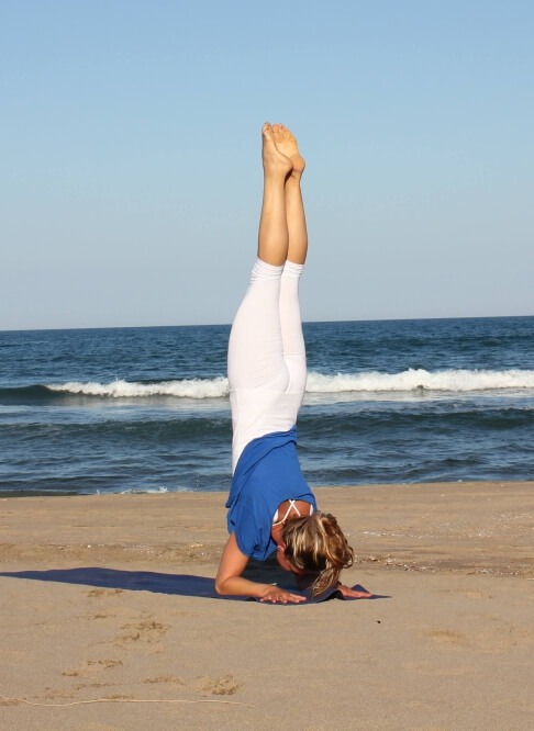 Beach yoga at sunrise in Barcelona