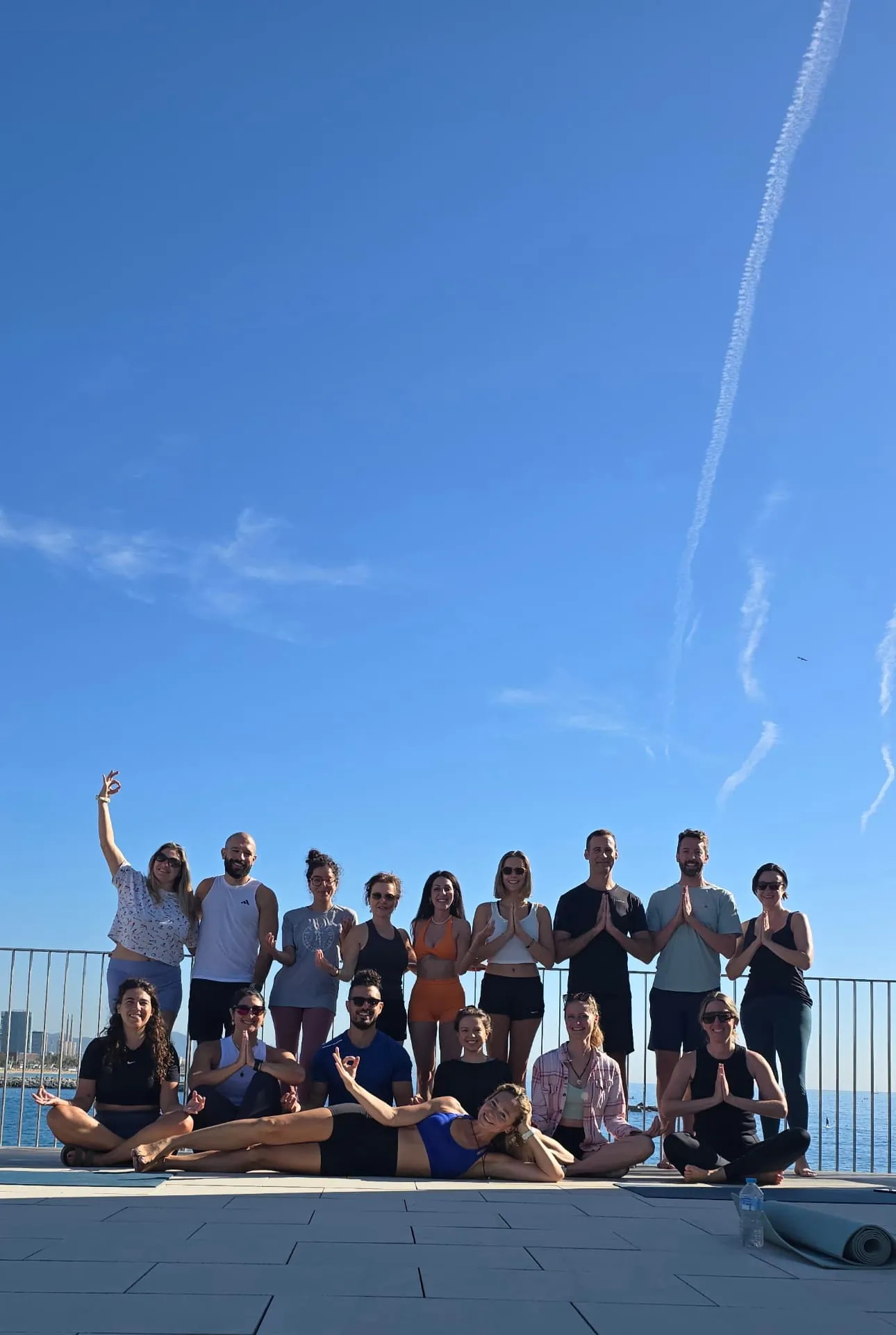 Beach yoga group at Mol de Gregal in Barcelona